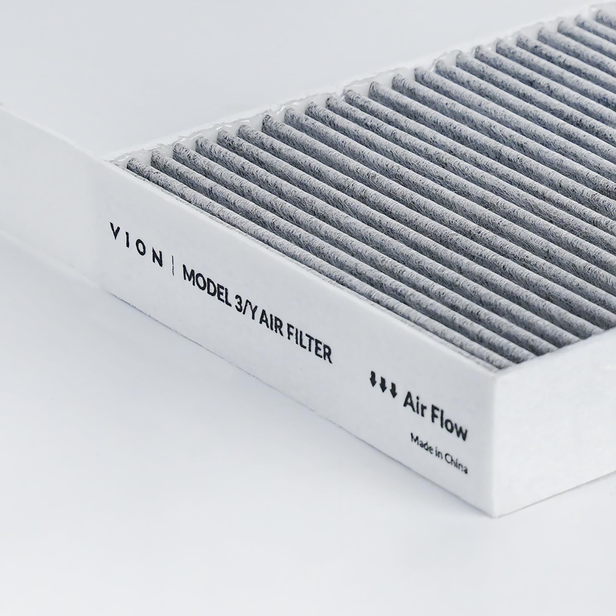 VION filter beside a coin illustrating compact OEM-standard size and easy handling