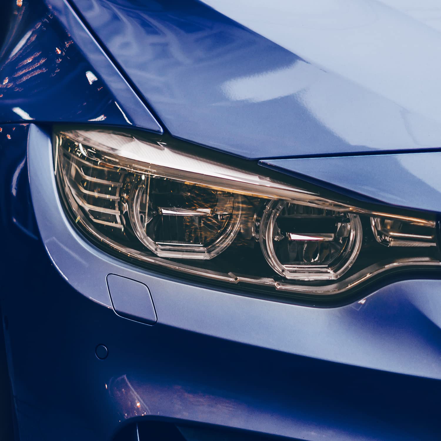 VViViD vinyl being applied to headlight demonstrating easy wet-install