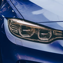 VViViD vinyl being applied to headlight demonstrating easy wet-install