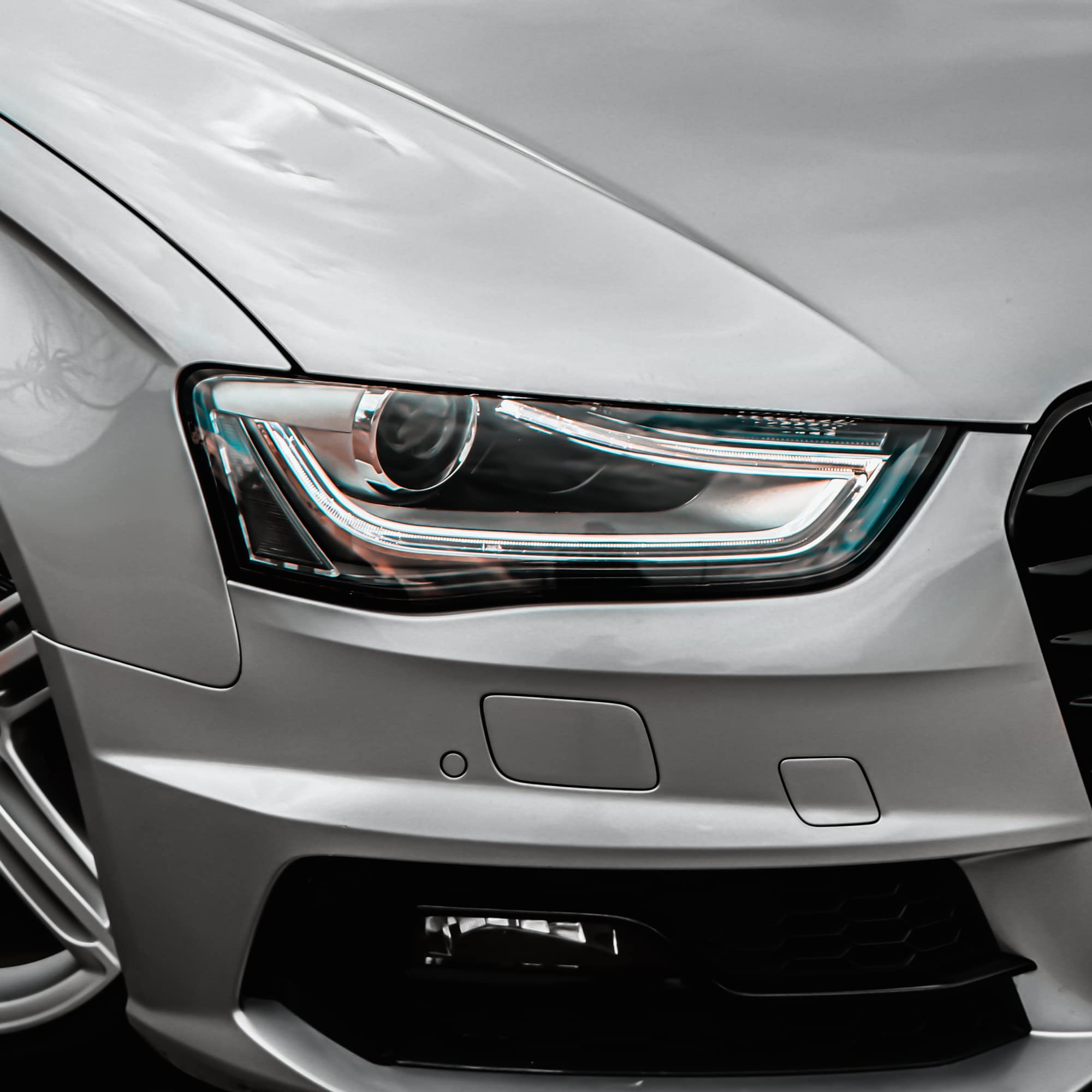 VViViD rolls beside headlight showing extra-wide size and coverage