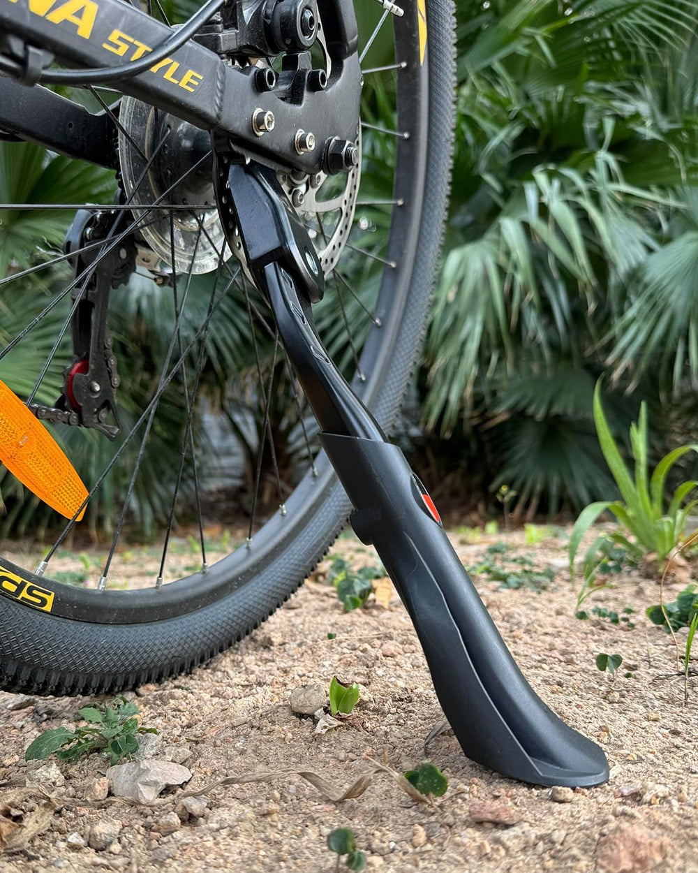 Wakano kickstand holding a bike upright on grass demonstrating reliable parking