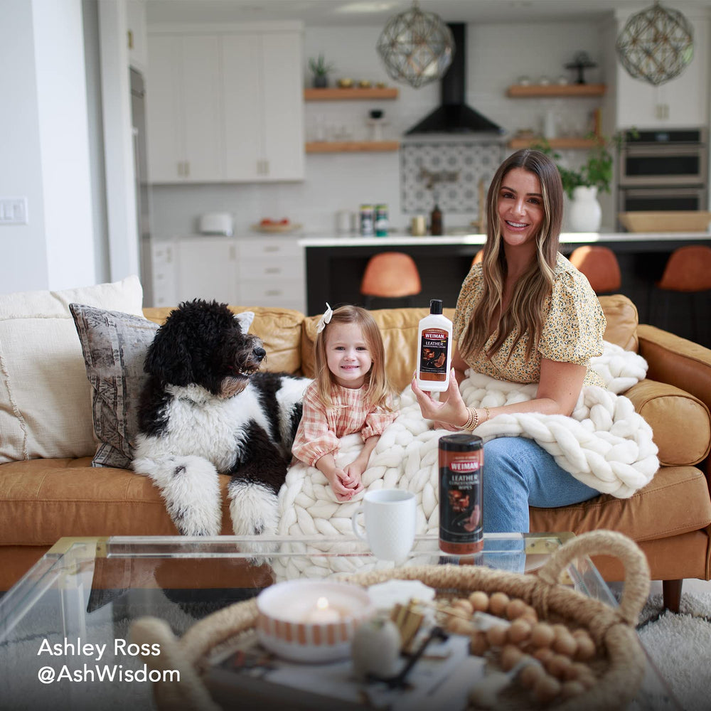 Weiman wipes beside leather sofa demonstrating home use and quick maintenance