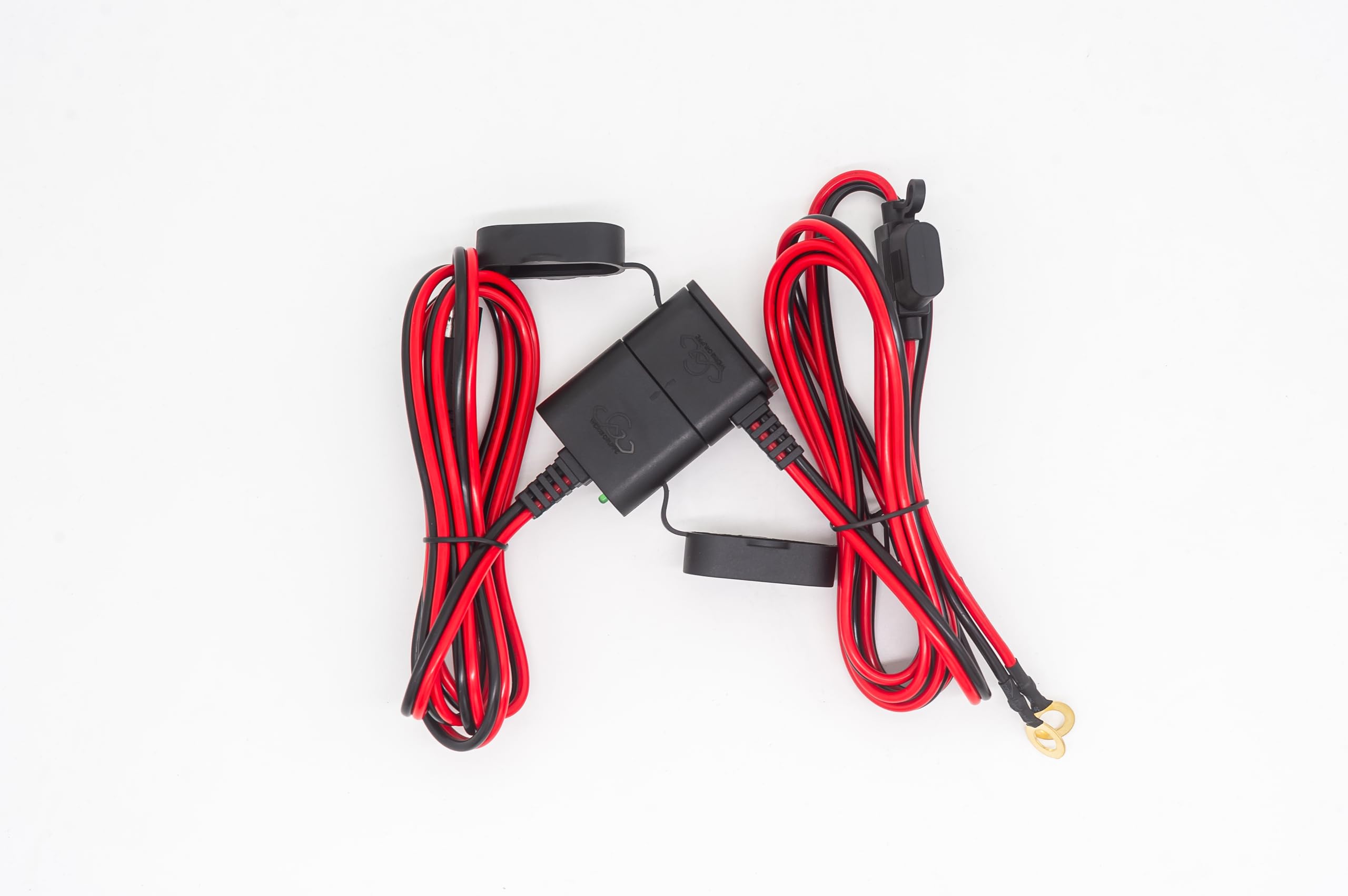 Werks Gruppe ChargeSafe next to a tape measure showing compact size and easy storage