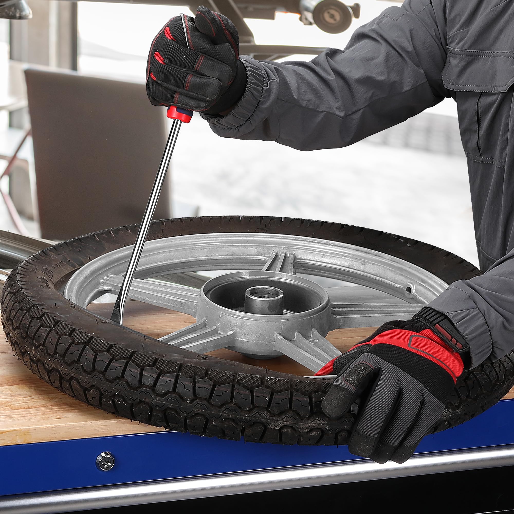 WORKPRO tire spoon beside ruler showing 14.5-inch length for increased leverage