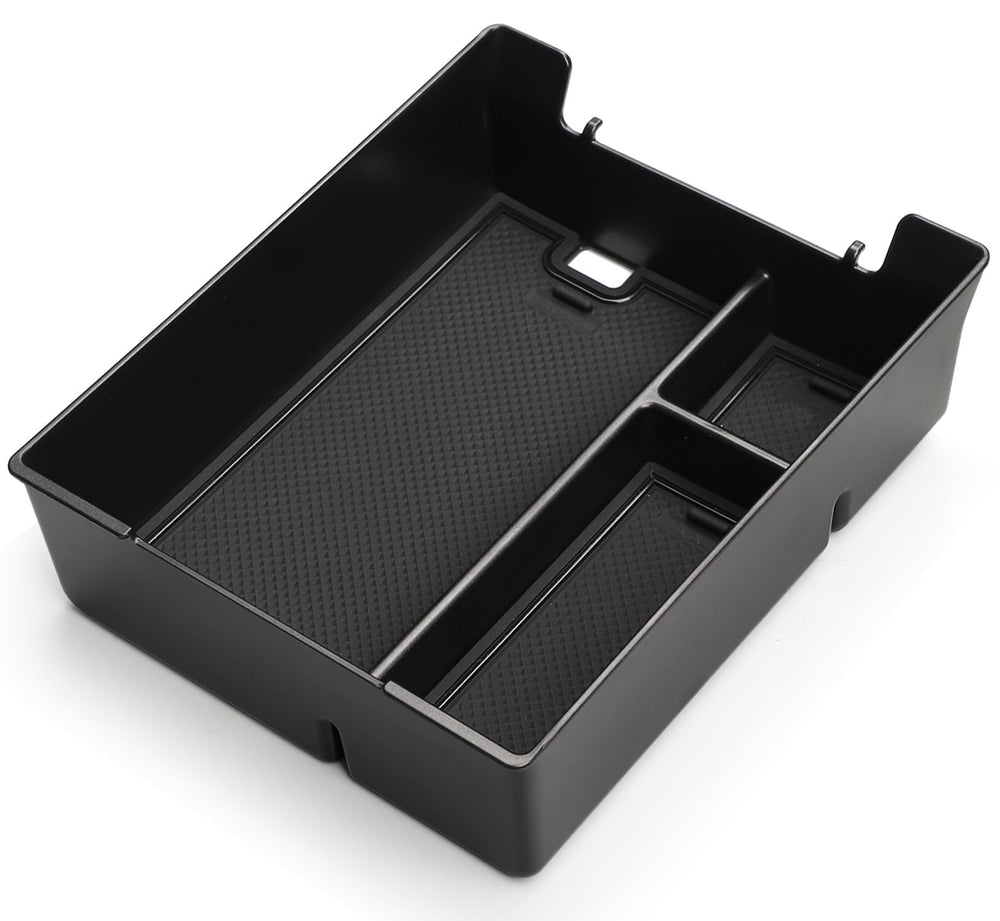 Wuchurth top-down of tray compartments displaying organized spaces for phones and coins