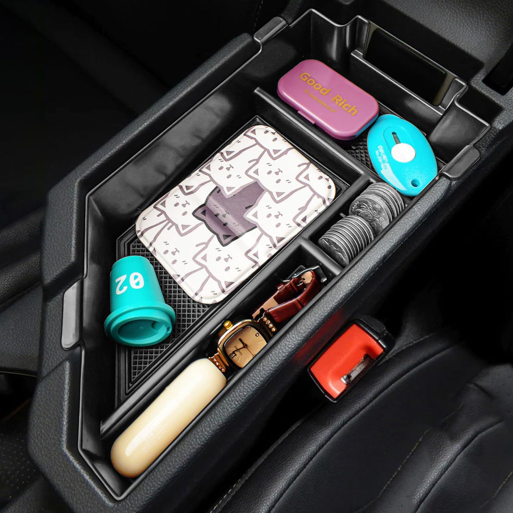 X-TKER lifestyle shot inside Jetta showing a tidy center console and improved usability
