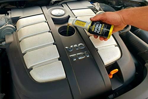 XADO bottle on garage workbench portraying home mechanic maintenance confidence
