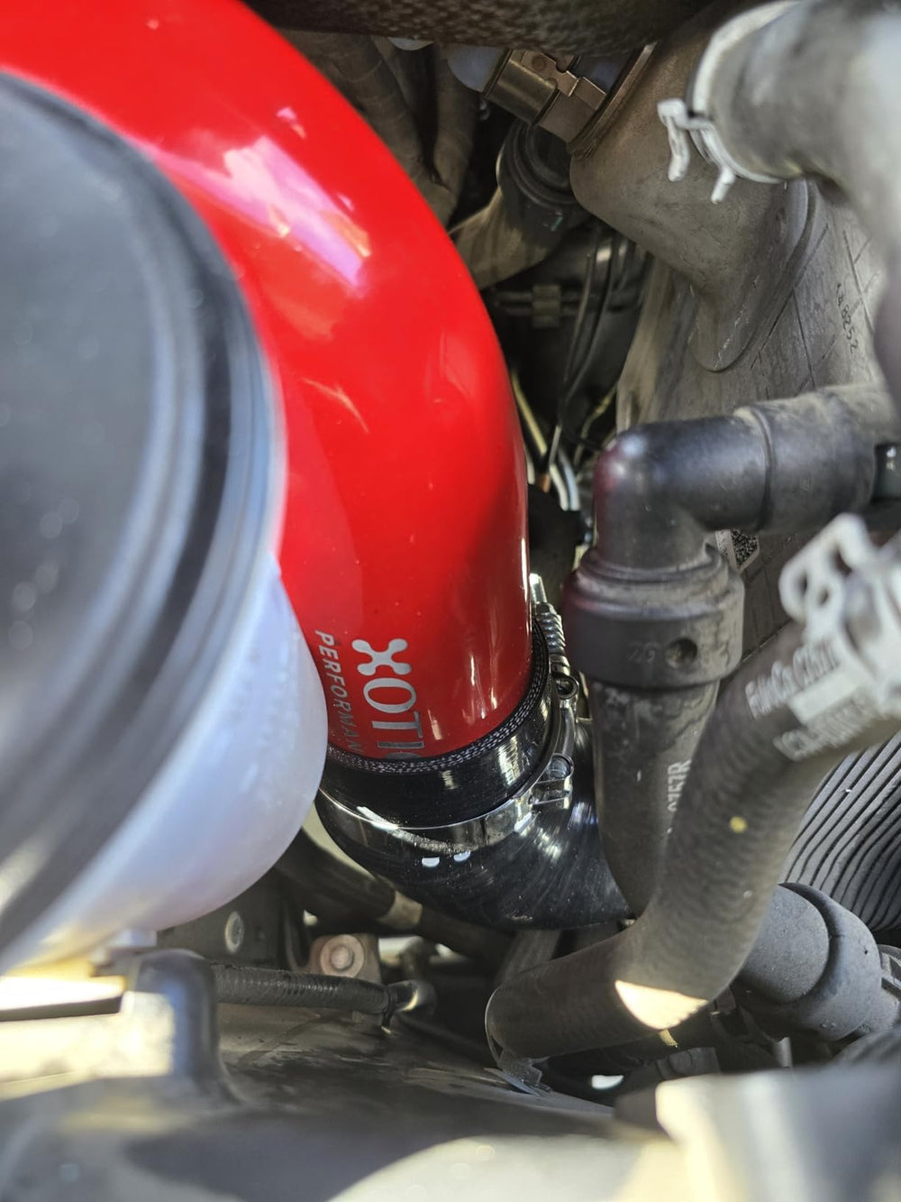 Xotic Performance stainless spring-loaded T-bolt clamp detail ensuring leak-free connection