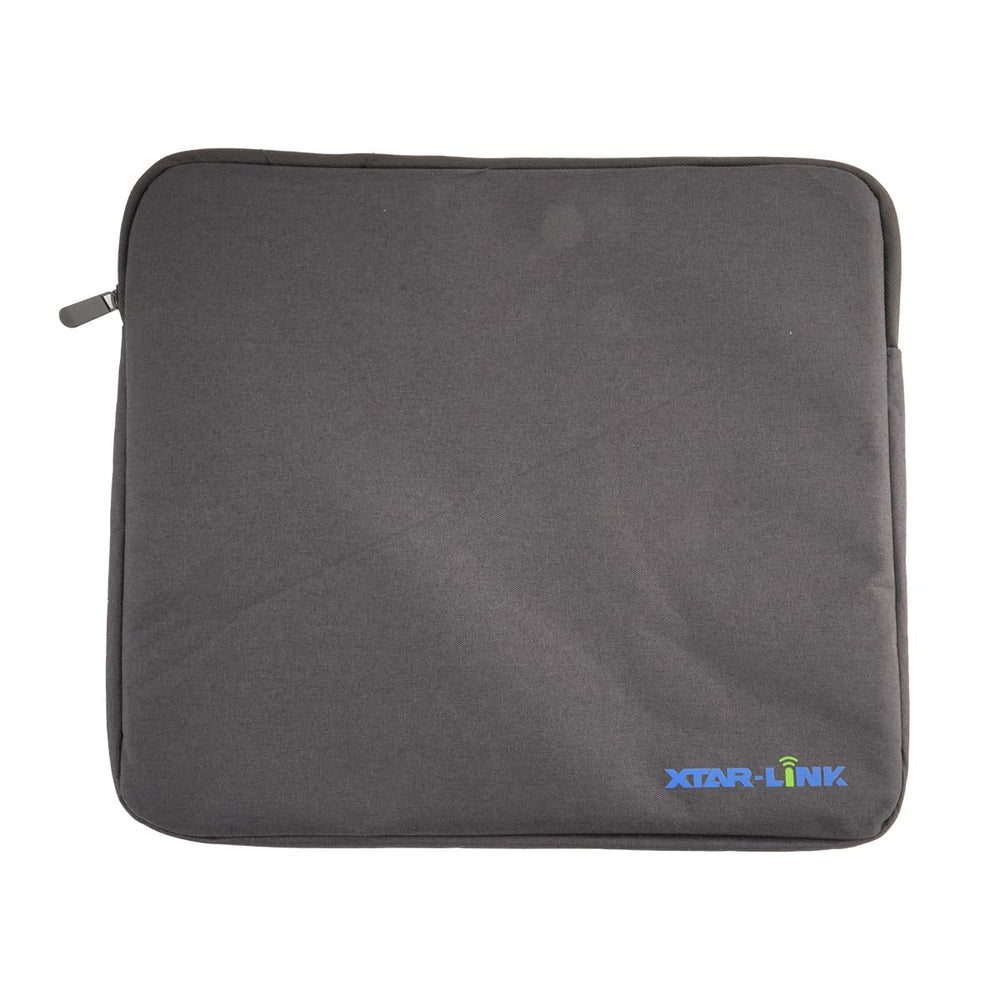 XTAR bag beside camping gear on a campsite illustrating outdoor portability and storage