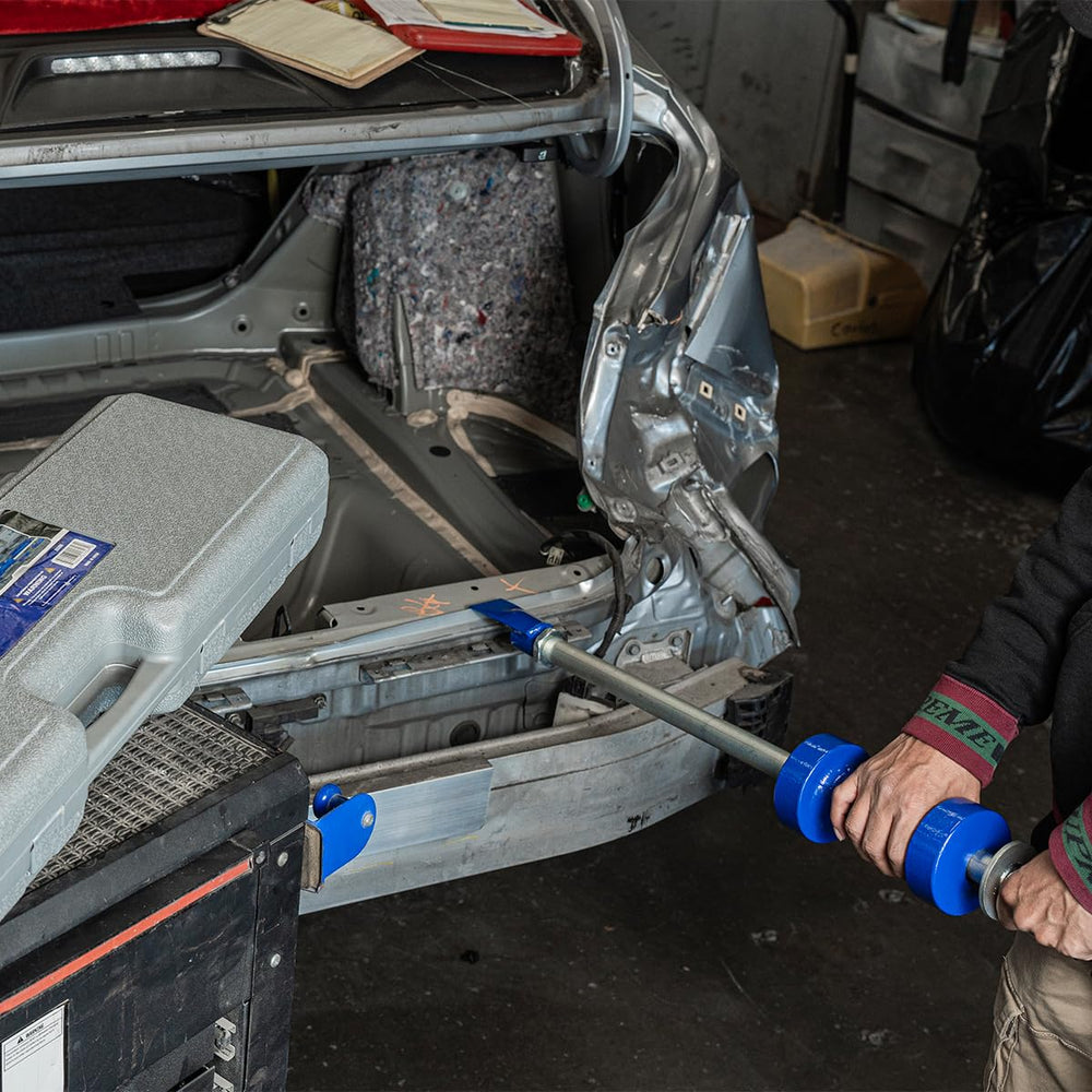XtremepowerUS slide hammer held in hand to show scale and improved leverage for repairs