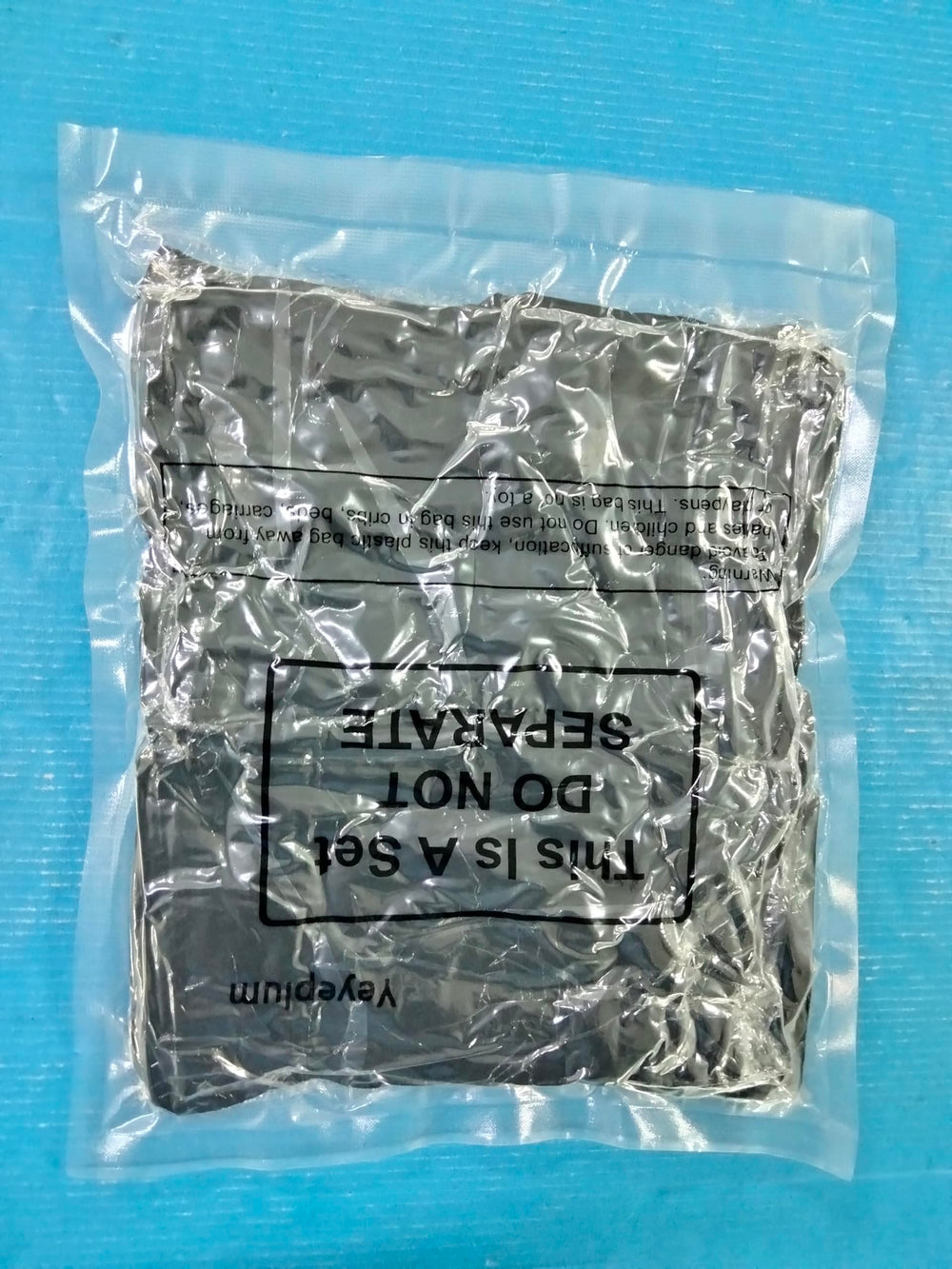 Yeyeplum bag next to helmet showing size fit and coverage