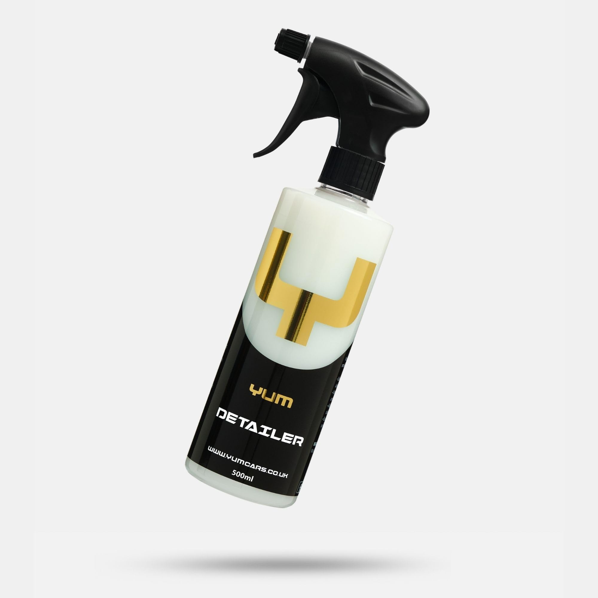 YumCars bottle held by hand showing 500ml size and portability