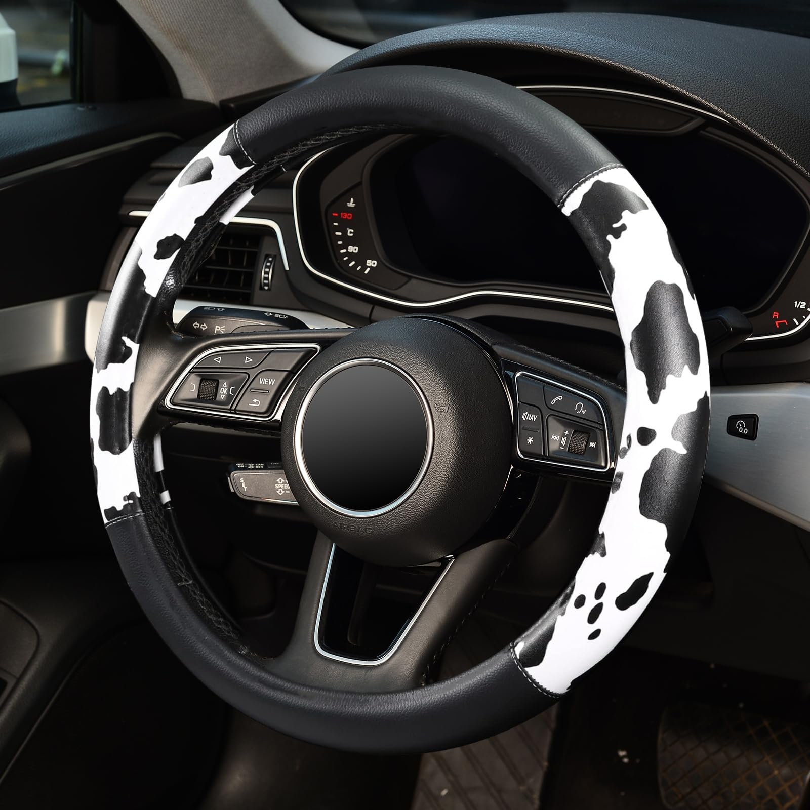ZHOL cow print installed on F150 steering wheel improving control and look