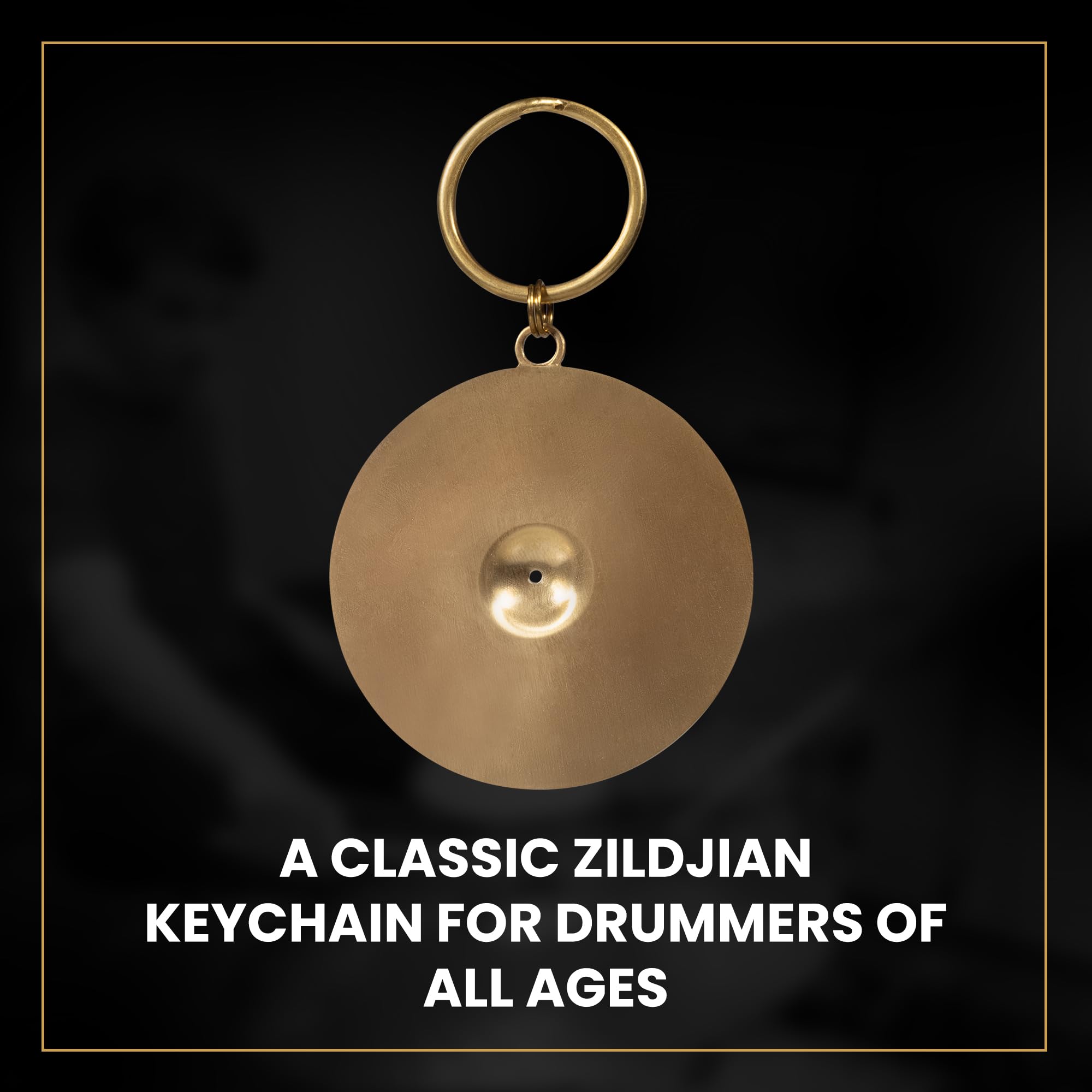 Zildjian cymbal keychain beside house keys to illustrate true size